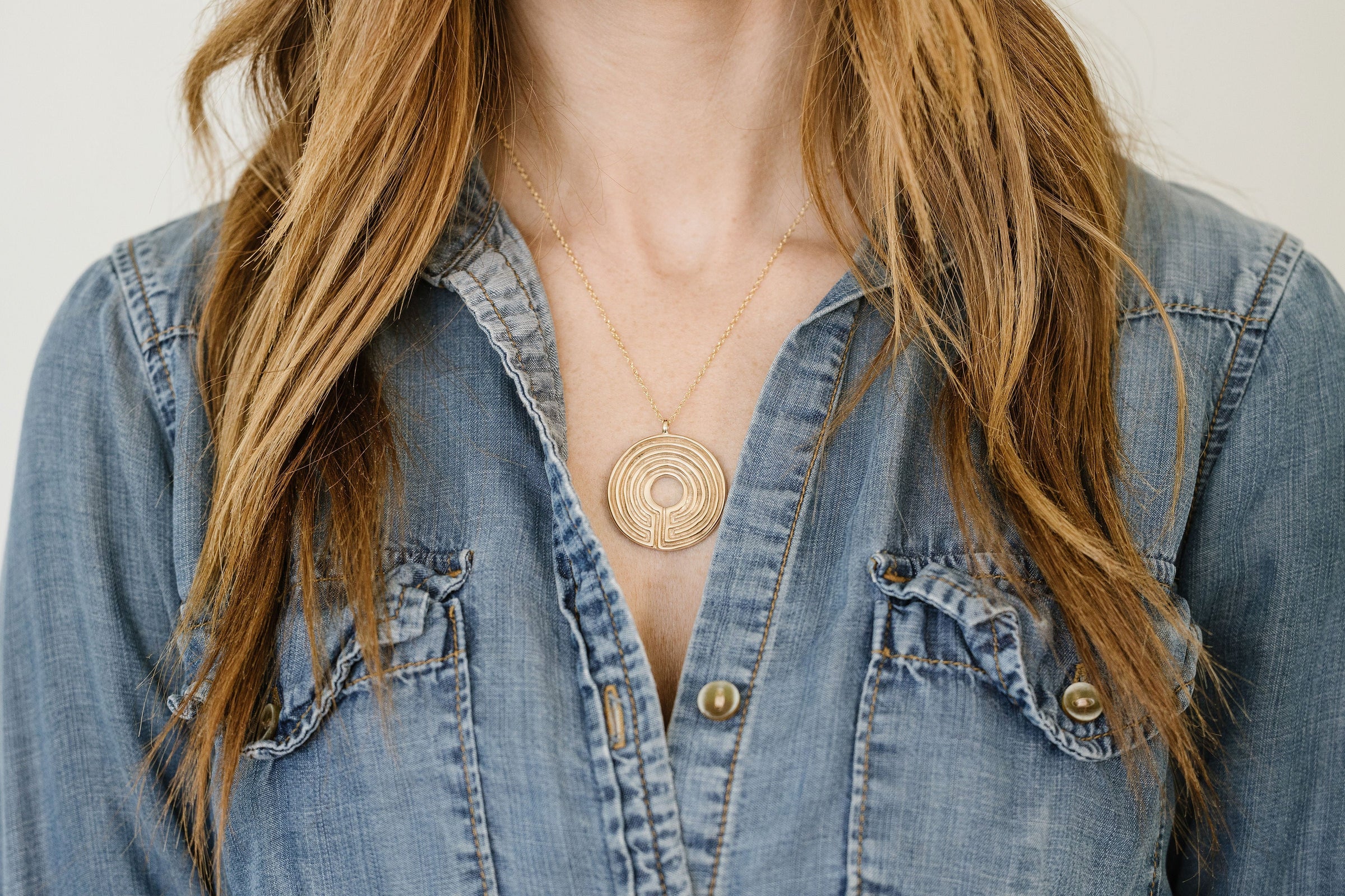 Woman Wears MIMOSA Handcrafted's Large Bronze Labyrinth Necklace