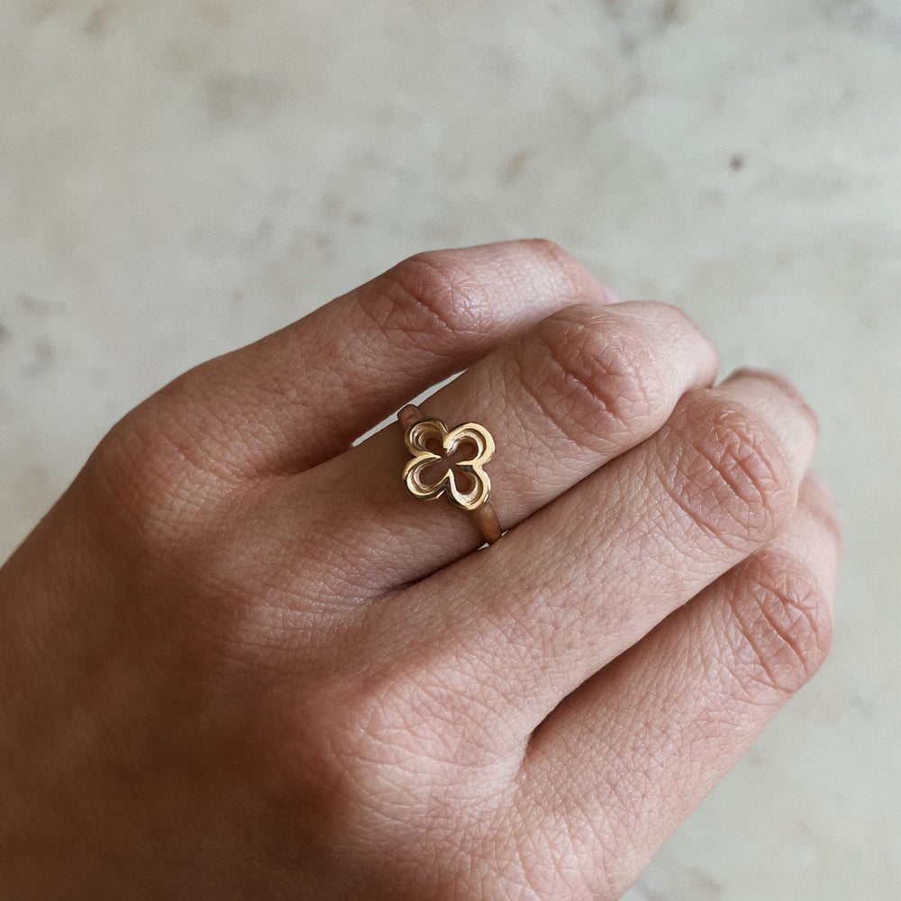 Person Wears 14K Gold Ring with Quatrefoil Design