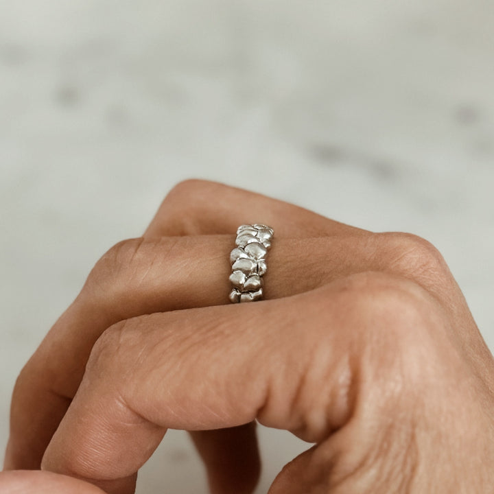 Person Wears the MIMOSA Handcrafted Osage Orange Ring in Sterling Silver