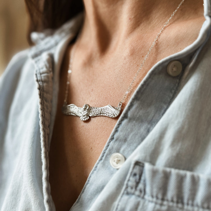Woman Wears the MIMOSA Handcrafted Owl Necklace in Sterling Silver