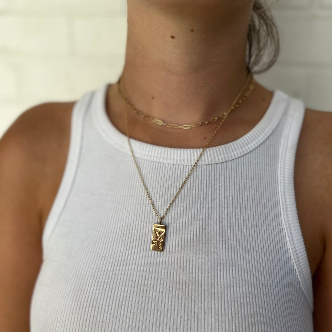 Woman Wearing Handcrafted Acadian Flag Pendant Necklace