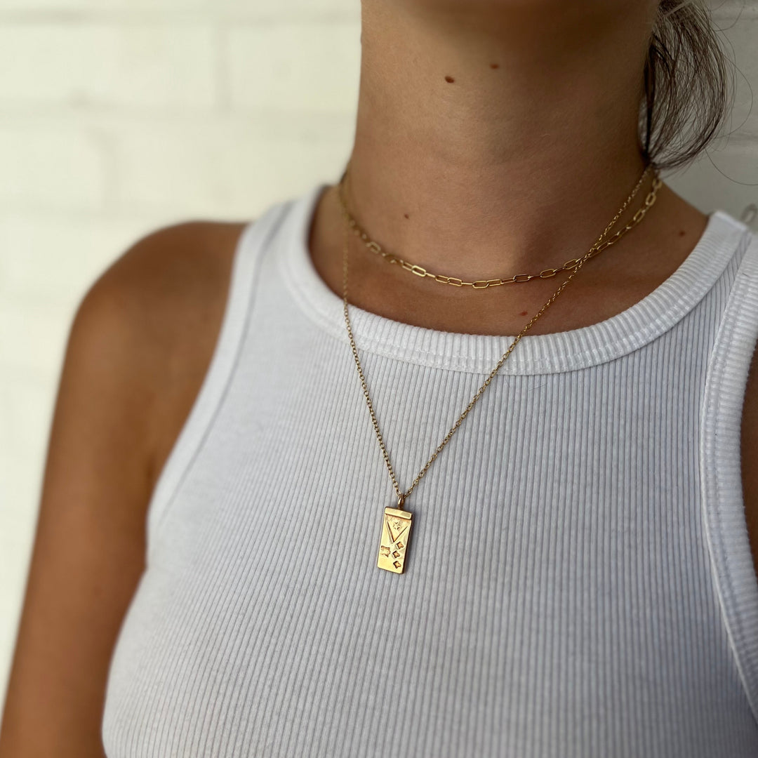 Woman Wearing Handcrafted Acadian Flag Pendant Necklace