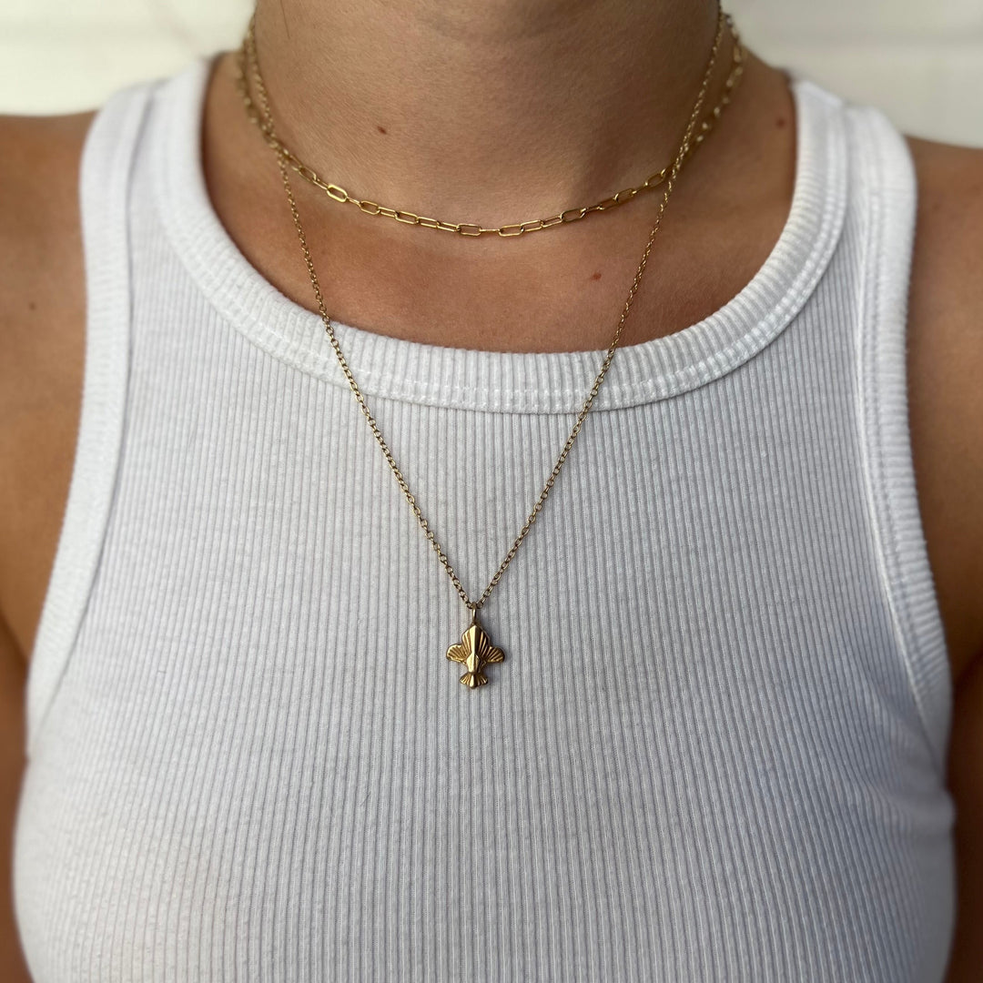 Woman Wearing Handcrafted Fleur De Lis Pendant Necklace