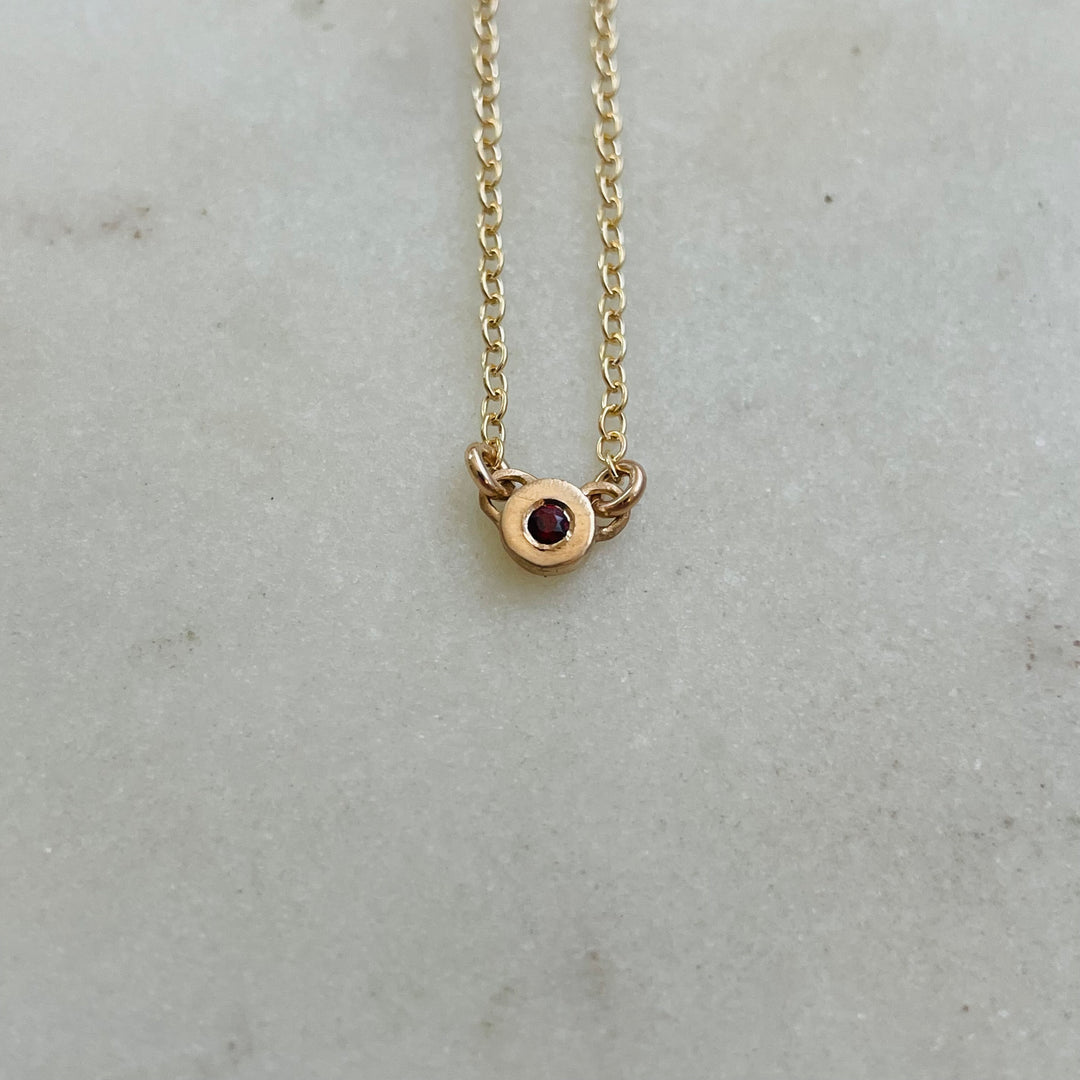 Handmade Bronze Grace Pendant Necklace With Garnet Birthstone