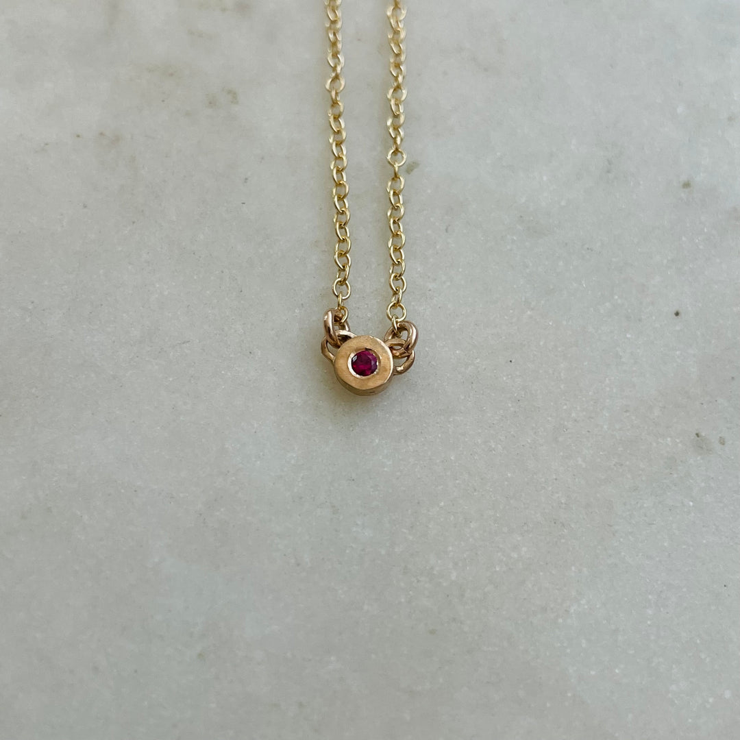 Handmade Bronze Grace Pendant Necklace With Ruby Birthstone