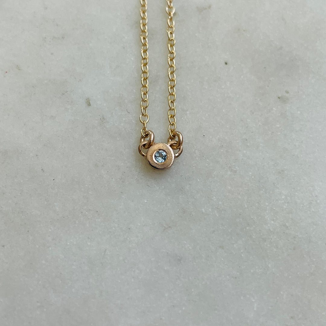 Handmade Bronze Grace Pendant Necklace With Blue Topaz Birthstone