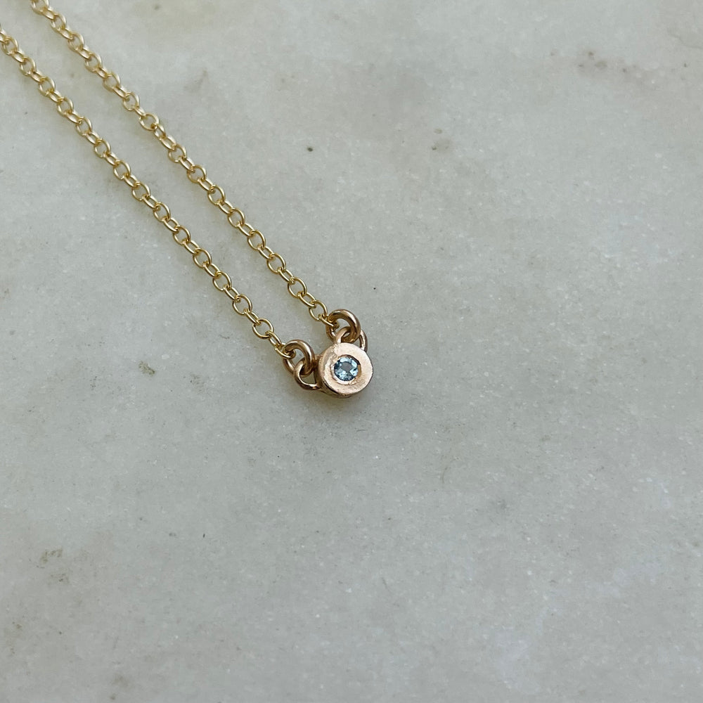 Handmade Bronze Grace Pendant Necklace With Blue Topaz Birthstone