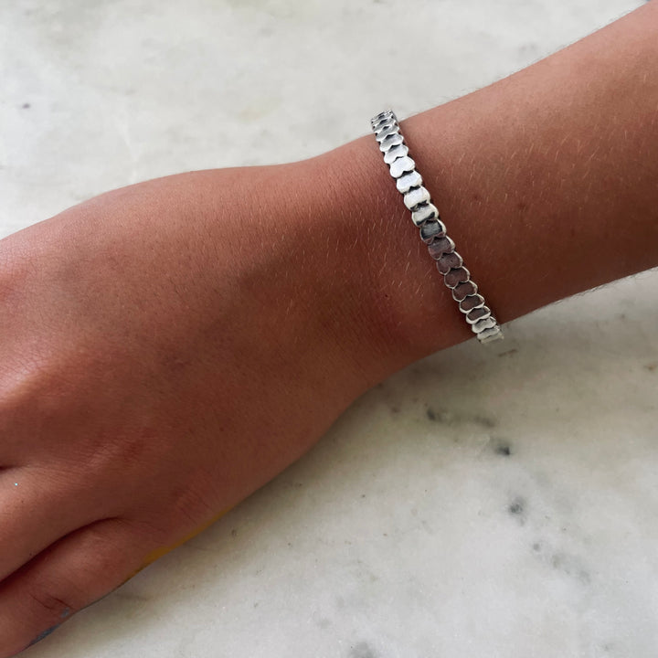 Handmade Sterling Silver Child Sized Heart To Heart Cuff Bracelet Worn By A Nine Year Old Girl
