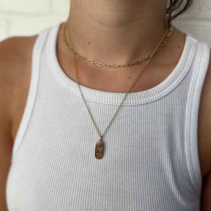 Woman Wearing Handcrafted Southern Cypress Swamp Nature Scene Pendant On Gold-Filled Necklace Chain