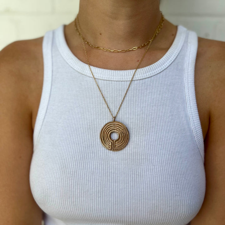 Woman Wearing Handcrafted Labyrinth Pendant Necklace