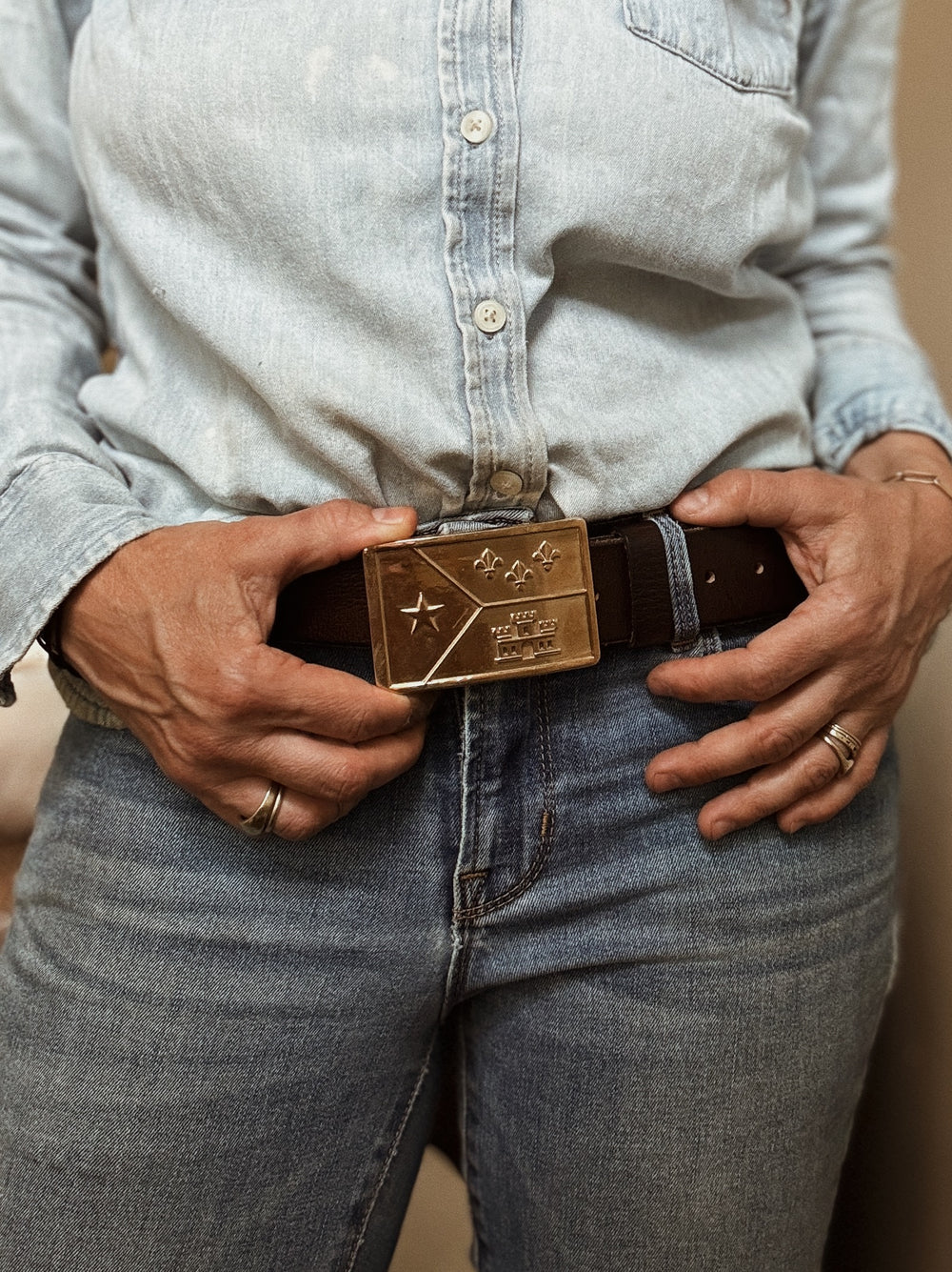 Person Wears the MIMOSA Handcrafted Acadian Flag Belt Buckle