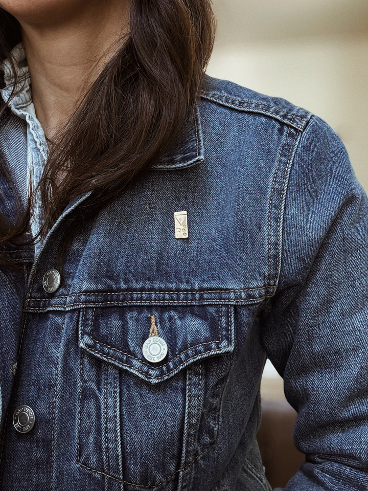 MIMOSA Handcrafted Acadian Flag Pin on a Denim Jacket