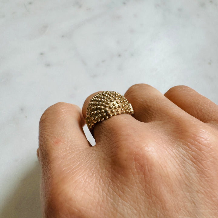 Woman Wears the MIMOSA Handcrafted Mock Strawberry Ring in Bronze