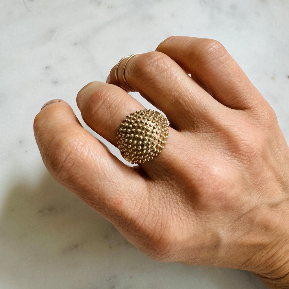 Woman Wears the MIMOSA Handcrafted Mock Strawberry Ring in Bronze