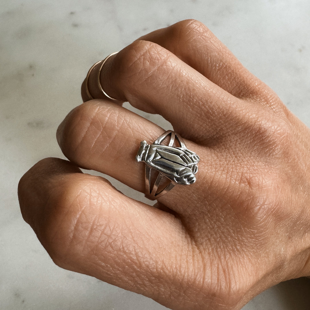 Person wears the MIMOSA Handcrafted Cicada Ring in Sterling Silver