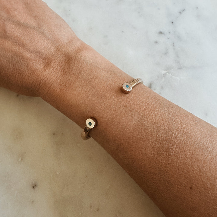 Woman Wears the MIMOSA Handcrafted Duo Turquoise Bracelet in Sterling Silver