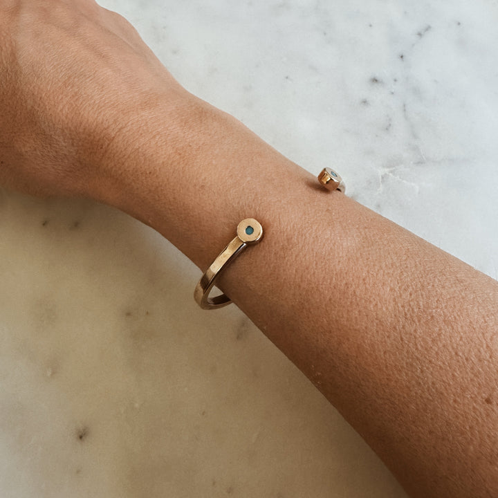 Woman Wears the MIMOSA Handcrafted Duo Turquoise Bracelet in Bronze