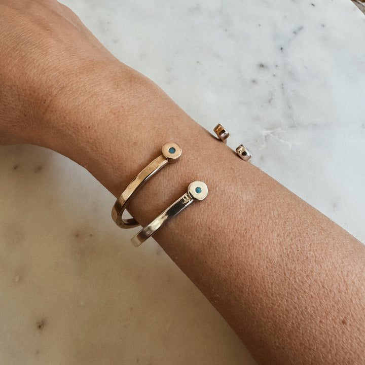 Woman Wears the MIMOSA Handcrafted Duo Turquoise Bracelet in Bronze
