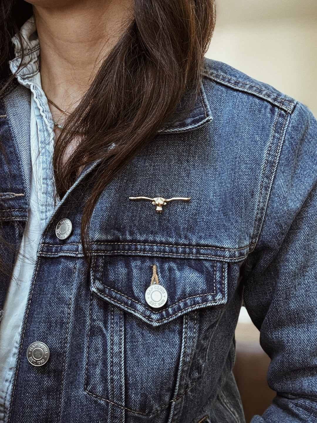 MIMOSA Handcrafted Longhorn Pin in Bronze on a Denim Jacket