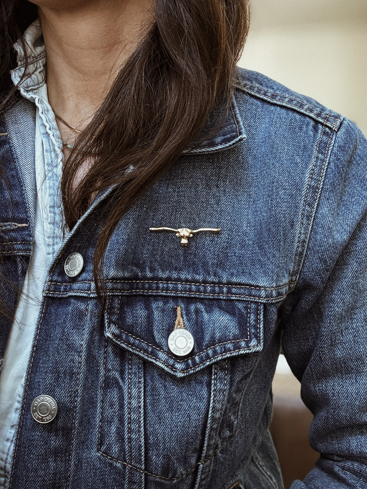MIMOSA Handcrafted Longhorn Pin in Bronze on a Denim Jacket