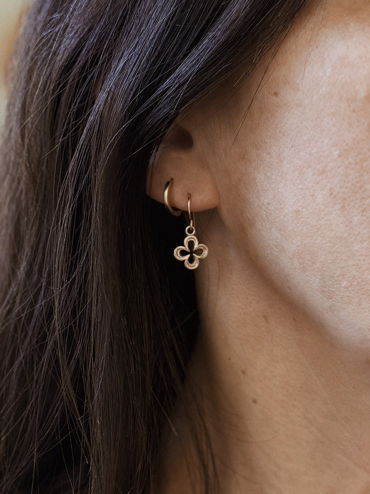 Woman Wears the MIMOSA Handcrafted Small Bronze Quatrefoil Earrings