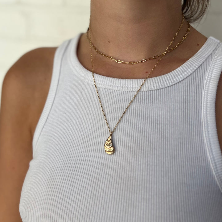 Woman Wearing Handcrafted Oyster Shell Pendant Necklace