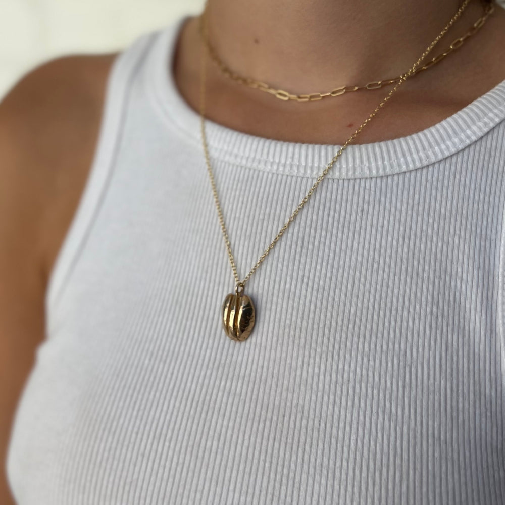 Woman Wearing Handcrafted Pecan Nut Pendant Necklace