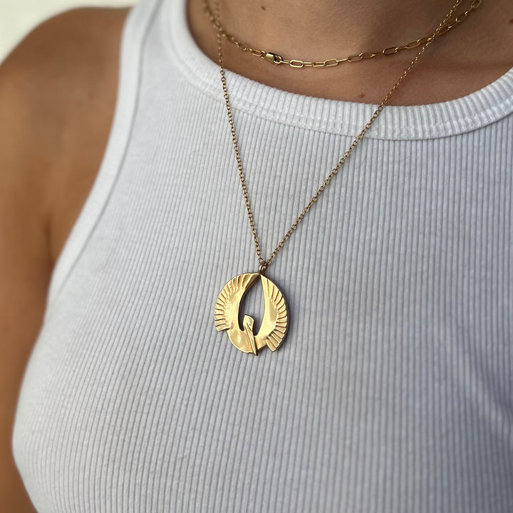 Woman Wearing Bronze Handcrafted Pelican Pendant Necklace