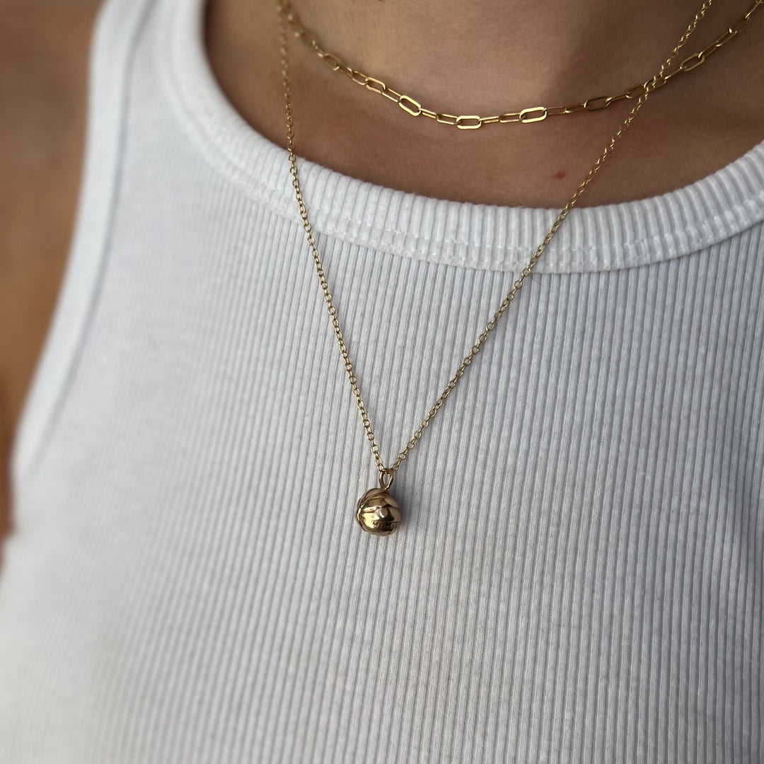 Woman Wearing Handmade Bronze Rollie Pollie Pendant Necklace