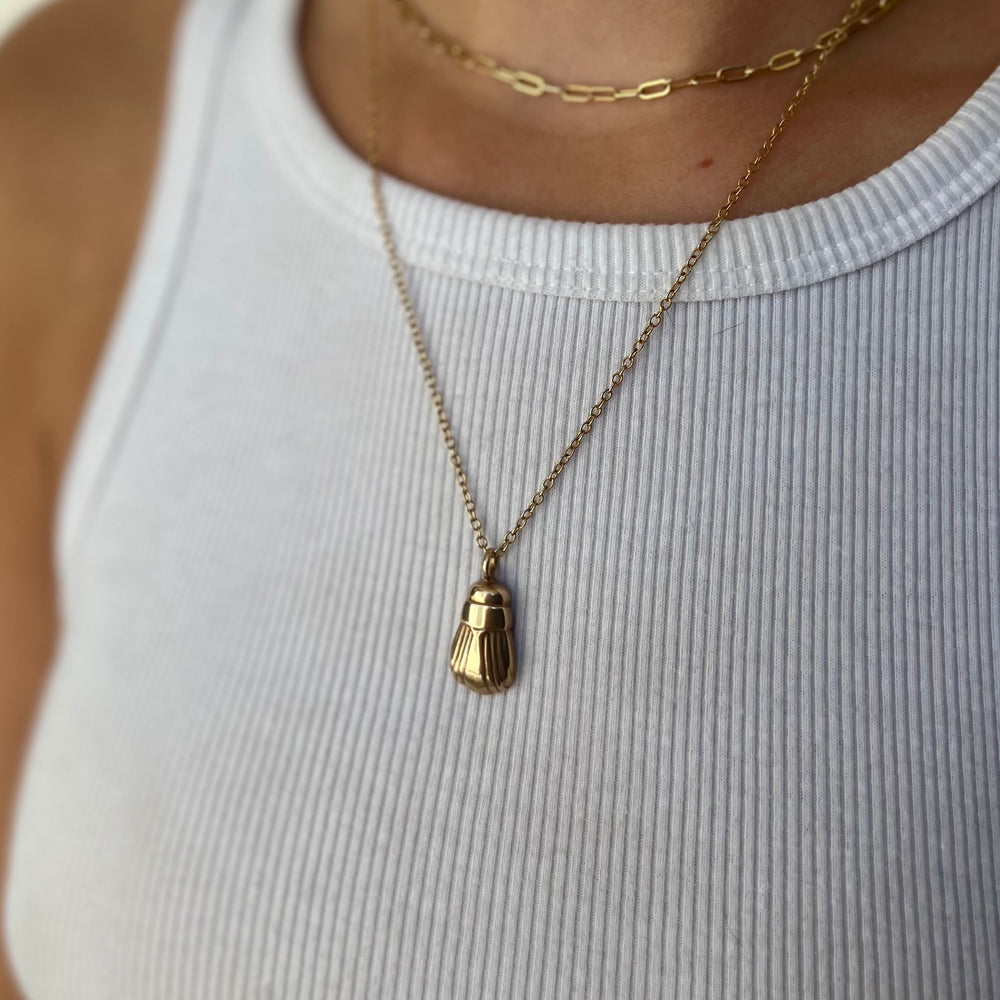 Woman Wearing Handcrafted June Bug Pendant Necklace