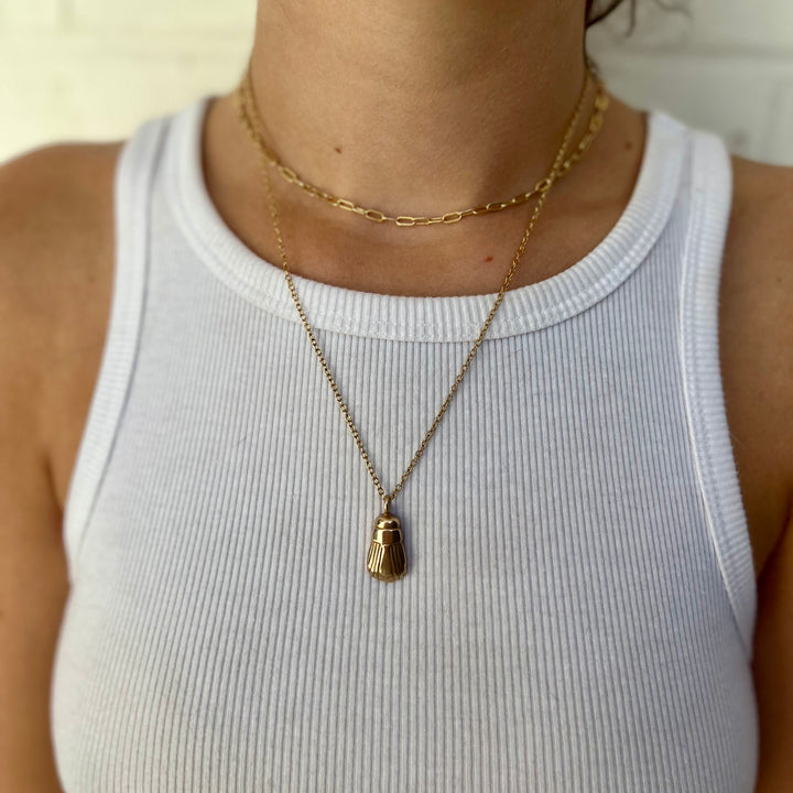 Woman Wearing Handcrafted Scarab Pendant Necklace
