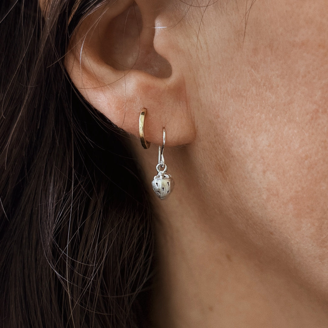 Woman Wears the MIMOSA Handcrafted Small Strawberry Earrings in Sterling Silver