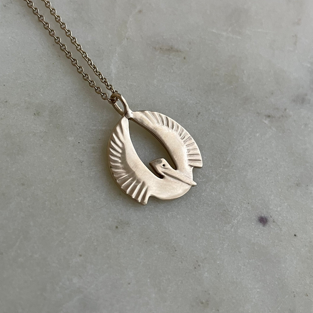 14K GOLD PELICAN RISING PENDANT — SMALL