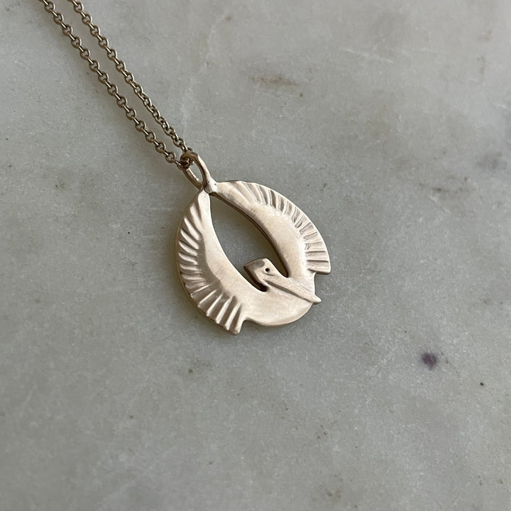 14K GOLD PELICAN RISING PENDANT — SMALL