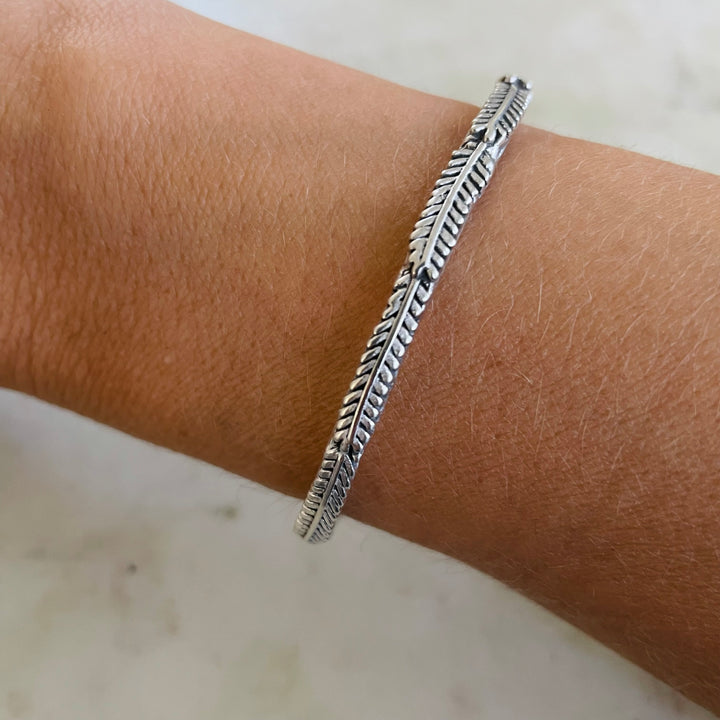 Woman Wearing Handmade Silver Mimosa Sprig Cuff Bracelet