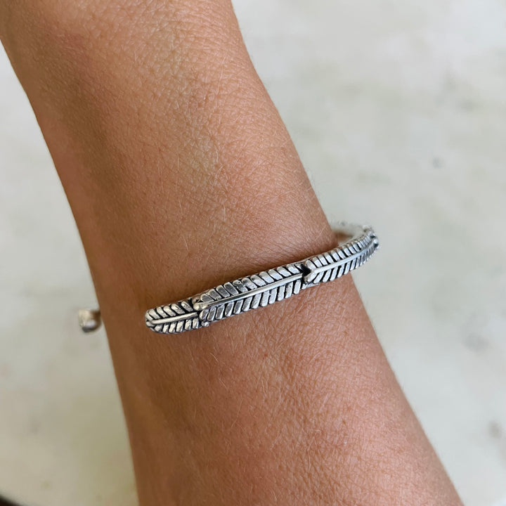 Woman Wearing Handmade Silver Mimosa Sprig Cuff Bracelet
