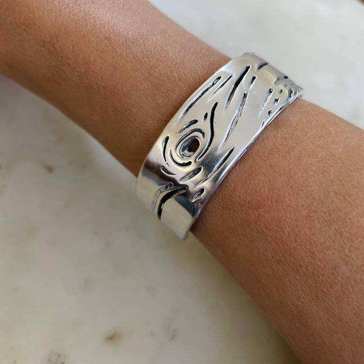 Woman Wearing Handmade Silver Pecky Cypress Cuff Bracelet