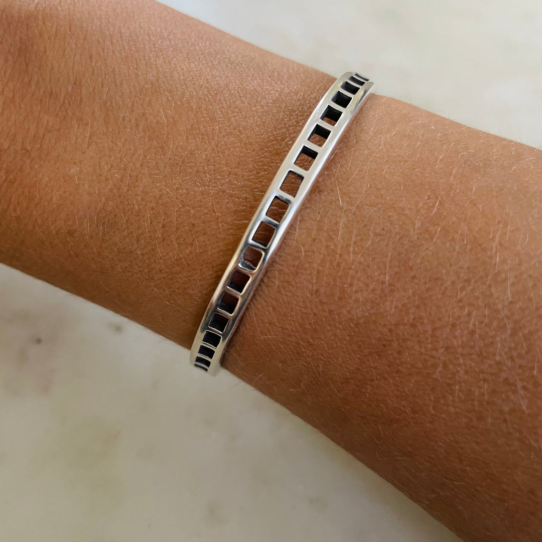 Woman Wearing Handmade Silver Single Row Grid Cuff Bracelet