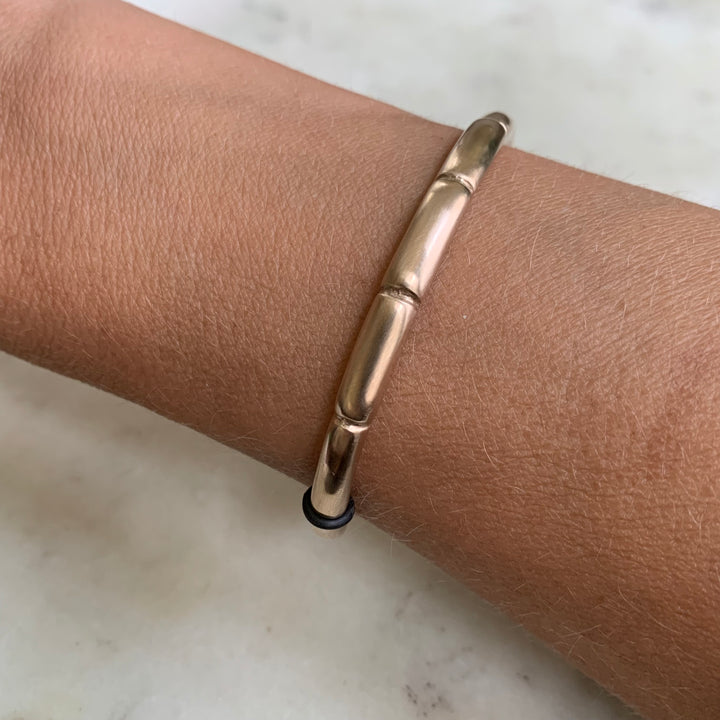 Woman Wearing Handmade Bronze Habit Tracker Cuff Bracelet