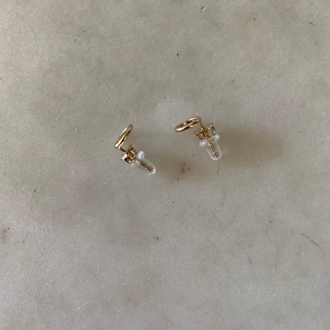 Gold-filled open circle stud earrings with ear nuts and rubber backs