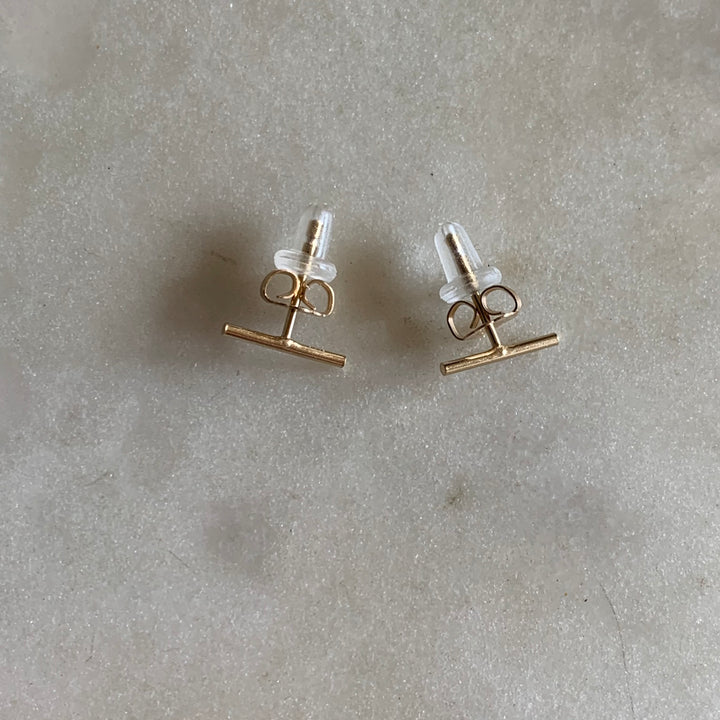 Gold-filled bar stud earrings with ear nuts and rubber backs
