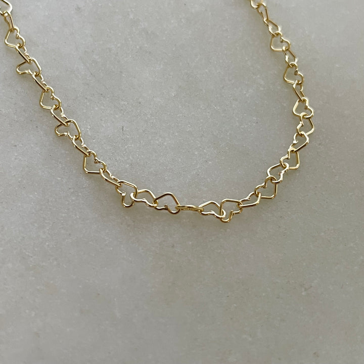 Dainty Gold-Filled Heart Chain Necklace Features Heart-Shaped Links.