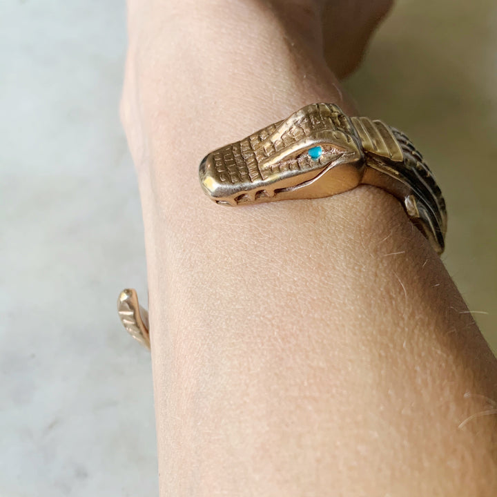 Woman Wearing Handmade Bronze Alligator Cuff Bracelet with Turquoise Eyes