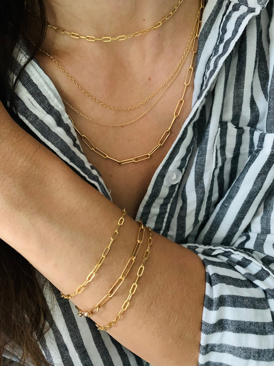 Woman Wears MIMOSA Handcrafted's Gold-Filled Chain Necklaces and Bracelets