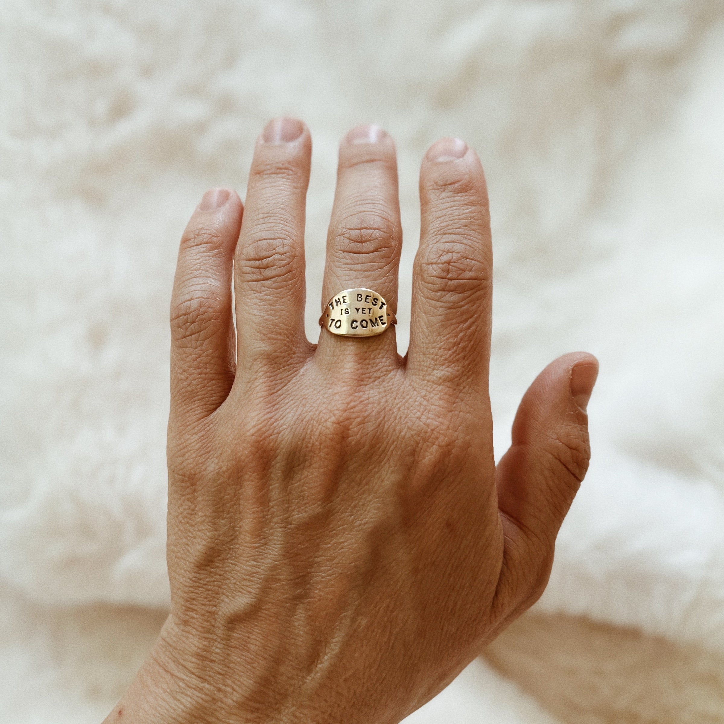 Person Wears the MIMOSA Handcrafted The Best Is Yet To Come Ring in Bronze