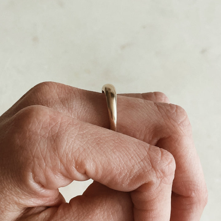 Person Wears a Dainty Dome Ring in 14K Gold