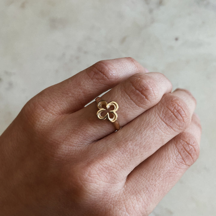 Person Wears 14K Gold Ring with Quatrefoil Design 