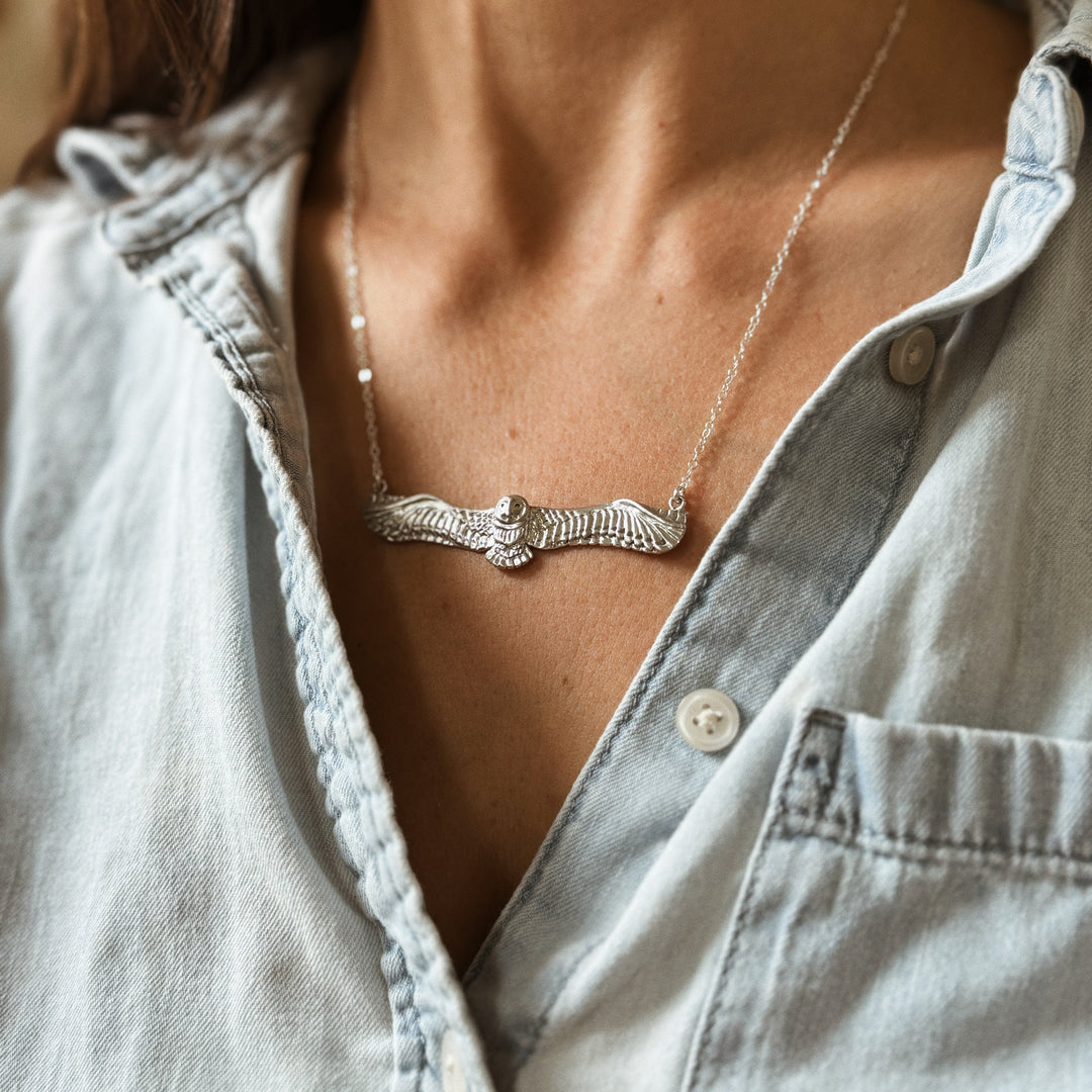 Woman Wears the MIMOSA Handcrafted Owl Necklace in Sterling Silver