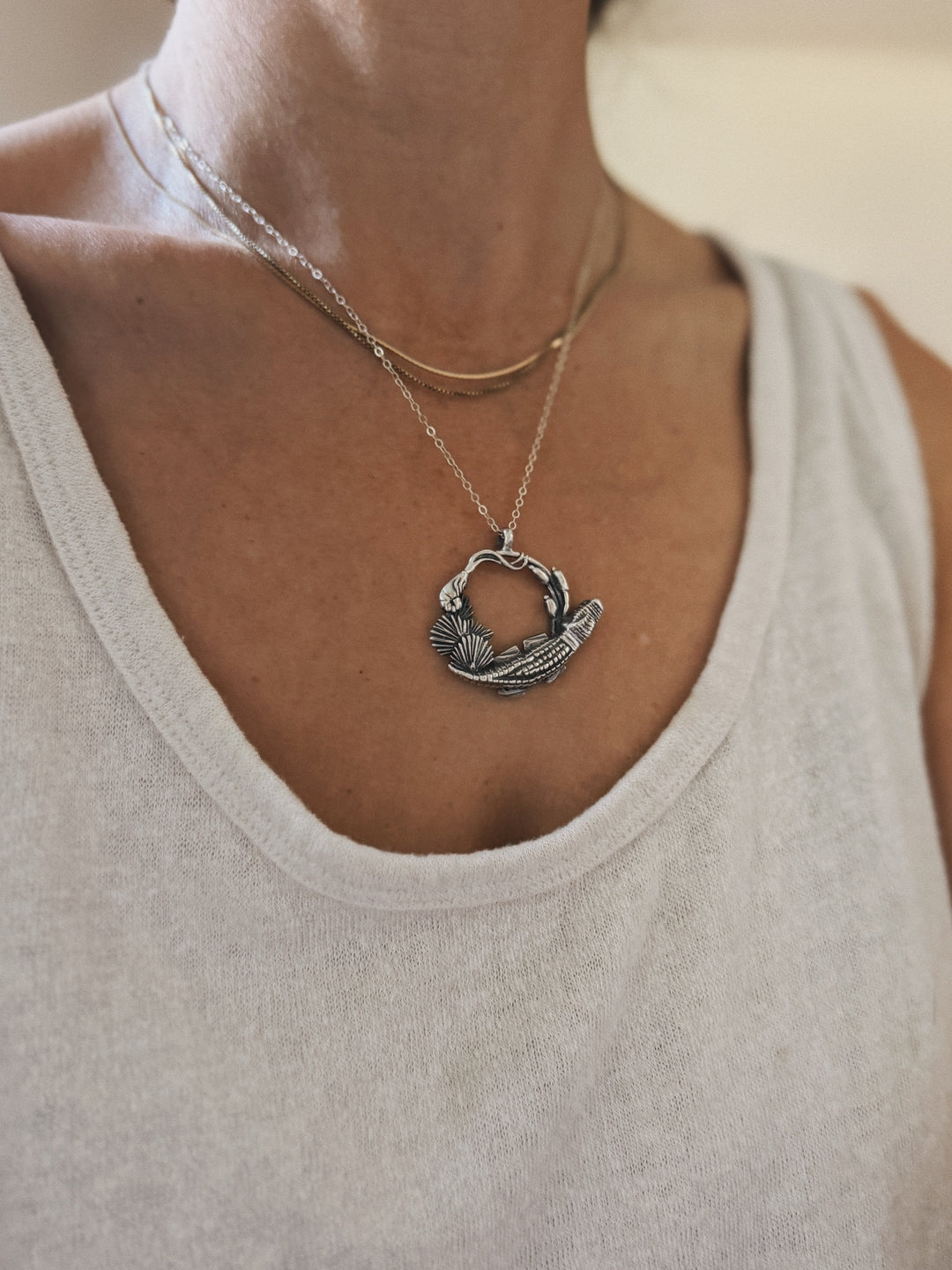 Woman wears Plein Wild Swamp-Inspired Pendant from MIMOSA Handcrafted