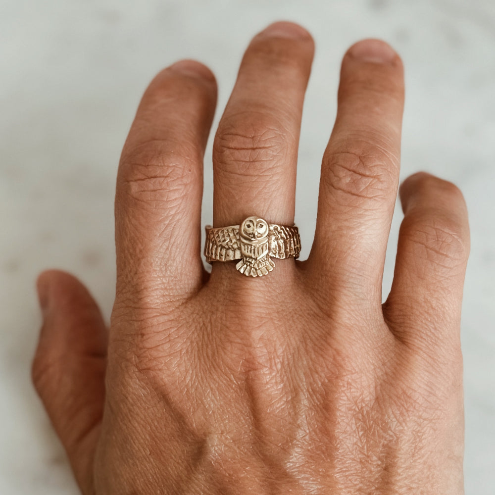 Person Wears the MIMOSA Handcrafted Owl Ring in Bronze